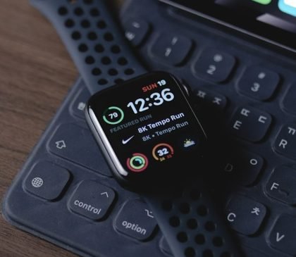 black smart watch on black computer keyboard